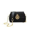 Elegant black box handbag with gold crown buckle, chain strap and sequin flap detail - Black