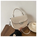Cream white saddle bag with chic patchwork design and silver metallic lock detail - Off White