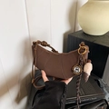 Dark brown crescent leather shoulder bag with circular charm and knotted strap - With Pendant / Brown