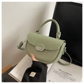 Light green saddle handbag featuring leather patchwork and silver crescent buckle - Green