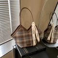 Retro brown plaid tote bag with V-cut edge and leather strap on a stylish book - Plaid Brown