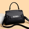 Black litchi pattern leather handbag with silver lock and wide strap in variant view - Black