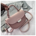 Pink saddle handbag featuring spliced textured fabric and a silver metal buckle lock - Pink