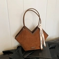 Retro brown suede tote bag featuring a V-shaped top and cream-colored logo ribbon - Brown