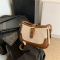 Borsa a tracolla vintage in tela beige e pelle marrone con fibbia in metallo e design chic - Marrone