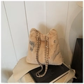 Cream plush bucket bag with silver bow pendant, pearl accents and chain strap - Khaki