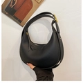 Black litchi grain hobo bag with gold hardware and adjustable strap detail - Black