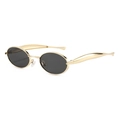 Lunettes de soleil ovales en métal doré avec branches larges et verres gris - Monture Dorée Verres Gris