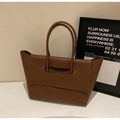 Minimalist dark brown lychee leather tote bag with unique cutout flap handle design - Brown