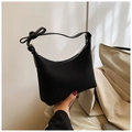 Chic black underarm bag featuring a trendy side bow detail and smooth leather texture - Black