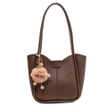 Minimalist brown leather tote bag with stylish plush charm and vertical stitching details - Brown