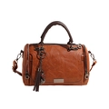 Brown Boston bag with pebble leather texture, cat tassel charm, and bronze hardware - Brown