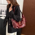 Vintage burgundy half-moon shoulder bag with gold rivets and glossy leather finish - Burgundy