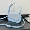 Light blue faux leather crossbody bag with grey textured fabric flap and silver hardware - Blue