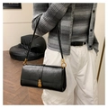 Minimalist black faux leather crossbody bag with golden clasp and adjustable strap - Black
