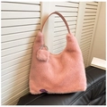 Chic pink faux fur tote bag with plush heart pendant and purple logo detail on black leather - Rose Pink