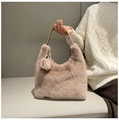 Light brown faux fur shoulder bag with plush pom-pom charm and sleek strap detail - Khaki