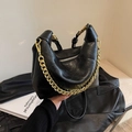 Black quilted dumpling bag with chunky gold chain strap and textured leather finish - Black