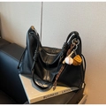 Detail of black matte leather tote with white contrast stitching and thick rope knot - Black