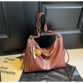 Brown large capacity leather tote bag with white contrast stitching and tassel detail - Brown
