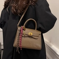 Retro khaki leather Kelly bag with golden twist lock and elegant woven charm detail - With Pendant / Coffee