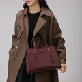 Chic burgundy lychee texture crossbody bag with top handle worn with a trench coat - Single Handbag / Purple