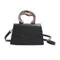 Elegant black leather trapezoid handbag with luxury rose gold metal handle and shoulder strap - Black