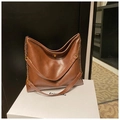 Retro dark brown large tote bag with gold swivel lock and chain strap on white stand - Brown