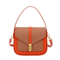 Orange leather shoulder bag with brown herringbone weave flap and gold twist lock - Orange