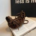 Winter faux fur leopard print crescent bag with brown leather strap on books - Brown