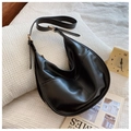 Minimalist black crescent hobo bag in faux leather with adjustable gold strap buckle - Black