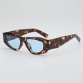 Retro thick tortoiseshell cat-eye sunglasses with blue lenses in a 45-degree angle view - Tortoiseshell Frame Blue Lens