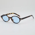 Retro oval sunglasses with tortoise shell frames and light blue lenses from a top view - Tortoiseshell Frame Blue Lens