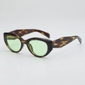 Cat eye sunglasses with dark tortoise shell frames and green lenses in 45-degree side view - Tortoise Frame Green Lens