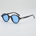 Retro round sunglasses with black glossy frames and light blue lenses at 45 degree angle - Shiny Black Frame Blue Lens