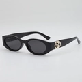Lunettes de soleil ovales noires rétro avec détails en métal doré et verres gris - Monture Noire Verres Gris
