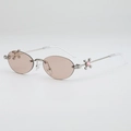 Frameless oval sunglasses with pink lenses and silver metal cross star temple detail - Silver Frame Champagne Lens