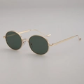 Lunettes de soleil rondes rétro en métal doré avec verres foncés en vue de trois quarts - Monture Dorée Verres Verts G15