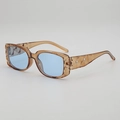 Brown faceted square sunglasses with light blue lenses and silver rivet accents - Transparent Tea Frame Blue Lens