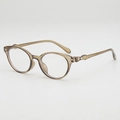 Minimalist oval tea-colored sunglasses with transparent frames and metal accents - Transparent Tea Frame Clear Lens