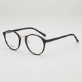 Minimalistische schwarze TR90 Rundbrille mit eleganten goldenen Metallstegen - Schwarzer Rahmen