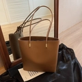 Brown litchi grain leather bucket bag with long straps and gold hardware detail - Brown