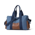 Borsa da viaggio in tela blu con dettagli in pelle marrone e tracolla regolabile - Blu