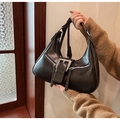 Detail of dark brown leather hobo bag with silver buckles and double zippers style - Brown