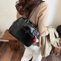 Elegant black oil wax leather shoulder bag for women with baseball pendant and silver hardware - Black With Pendant