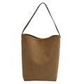 Minimalist brown suede bucket bag with sleek stitching and slim leather shoulder strap - Brown