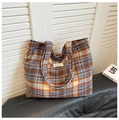Large blue and orange checkered woven tote bag with thick woolen texture and label detail - Blue
