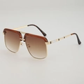 Retro square metal sunglasses with brown gradient lenses and gold frames at a side angle - Brown Brow Tea Gradient