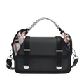 Chic black and grey textured crossbody bag with a patterned silk scarf on handle - Black
