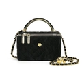 Quilted black vanity bag with gold flower buckle and chain strap shown in profile - Black